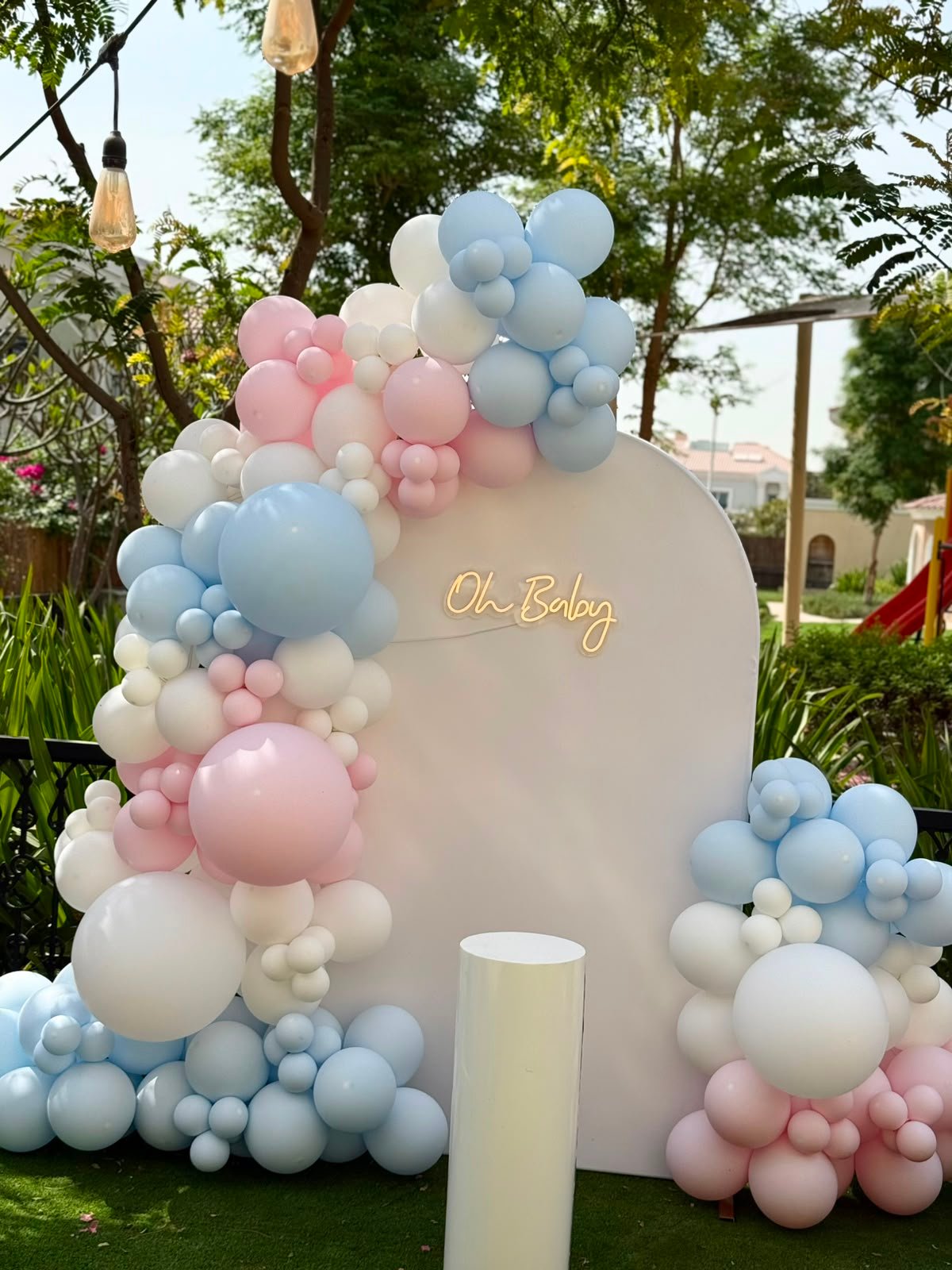 Outdoor pastel baby event setup