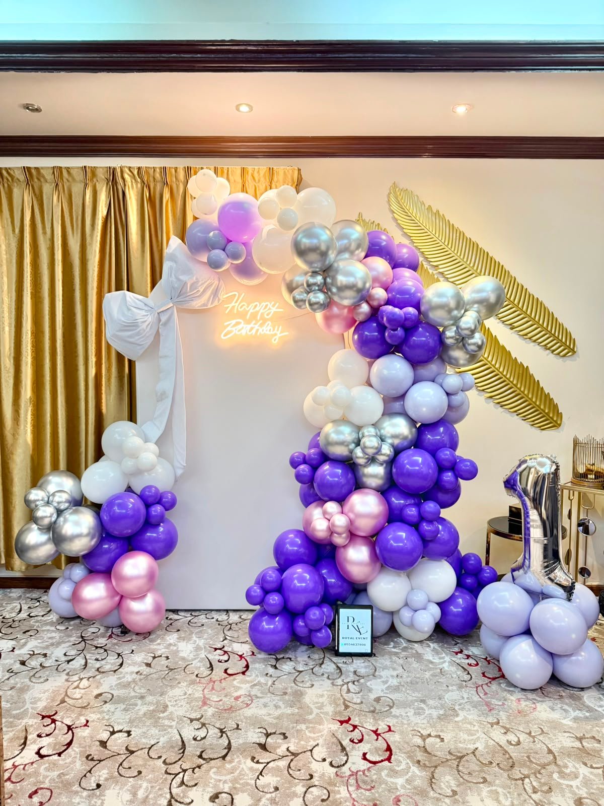 Orange and white baby shower setup